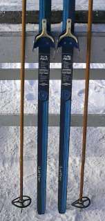 The skis are signed LAMPINEN. Measures 83 (215 cm) long. Have 3 pin 