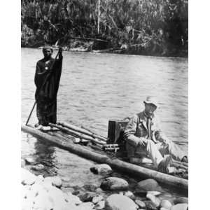 com 1800s photo Explorer, with Indian, on raft, in the  Jungle 