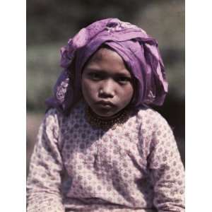  Child Poses in Purple at Fort De Kock, Dressed for an 