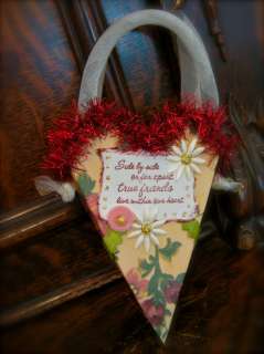 Lovely red Bethany Lowe tinsel garland trims the top, and the hanger 