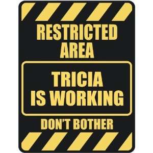   RESTRICTED AREA TRICIA IS WORKING  PARKING SIGN