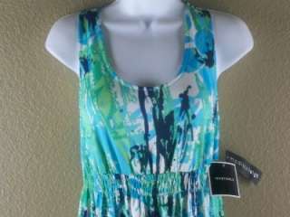   ; and sleeveless. Floral patter with shades of green, blue and teal