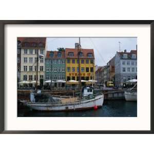 Boats in Canal by Buildings, Copenhagen, Denmark Collections Framed 