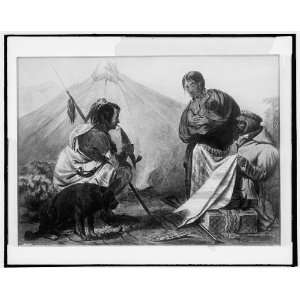 Indian man,woman,child with a trader showing a blanket  