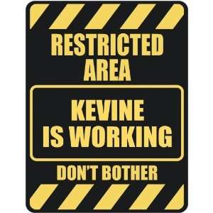   RESTRICTED AREA KEVINE IS WORKING  PARKING SIGN