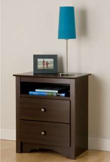 Nightstand with drawers next to a bed