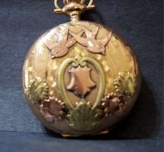 this is a antique 14k solid gold pocket watch with 3 different colors 