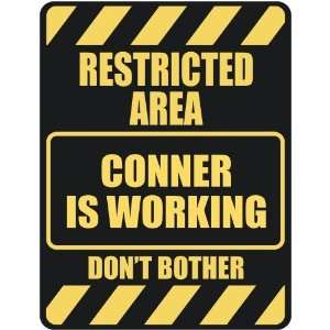   RESTRICTED AREA CONNER IS WORKING  PARKING SIGN
