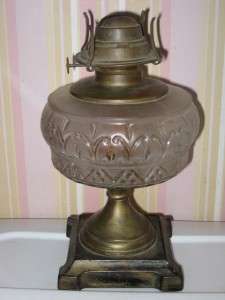 THIS IS A LOVELY ANTIQUE OIL LAMP. IT HAS METAL BASS WITH BEAUTIFUL 