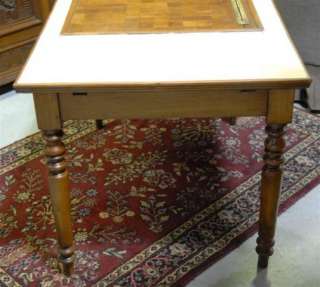 that has been restored with yellow tile top and built in cutting board 