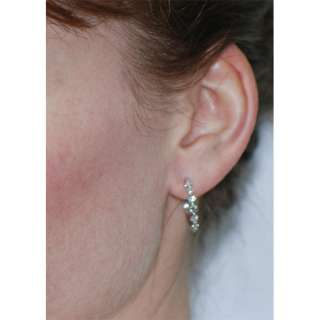  Diamond hoop earrings with shared prong setting. The earrings 