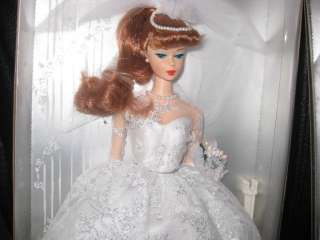 readhead barbie has reddish hair up in a ponytail blue eyes barbie 