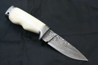 Custom damast hunting knife. Razor sharp and top leather sheath 