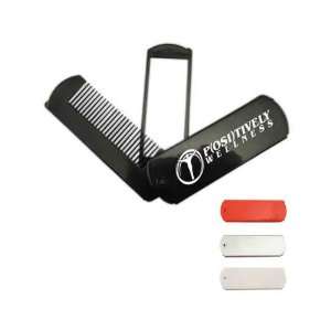Compact folding travel hair comb with mirror that fits neatly into 